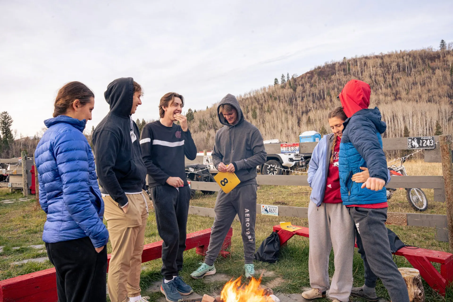 Runners gathered around a campfire after the race, laughing together