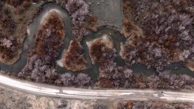 Aerial view of Fall Creek winding through the valley